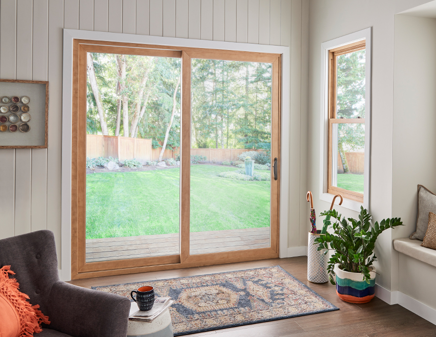 Living room with a Simonton 5500 Double Hung window and an Inovo Patio Door, both of which earned the Good Housekeeping Seal.